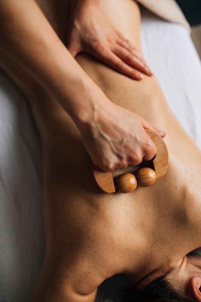 services-03 A soothing massage session using a wooden roller for ultimate relaxation and self-care.